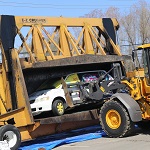 NoviSchoolsLoadingCarCompactor